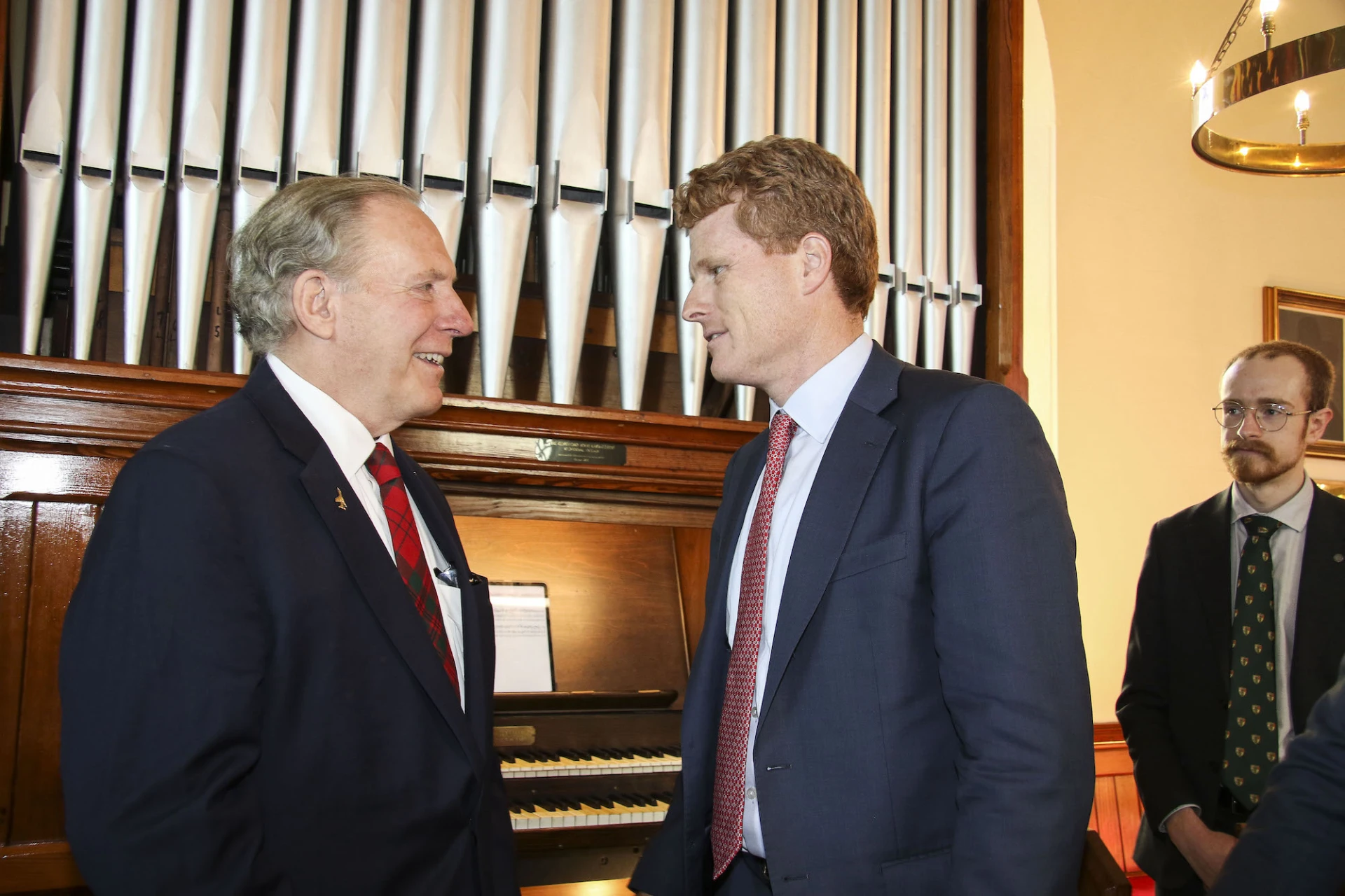 Henry Livingston chats to Joe Kennedy III at the Livingston Organ along with Jack McCabe