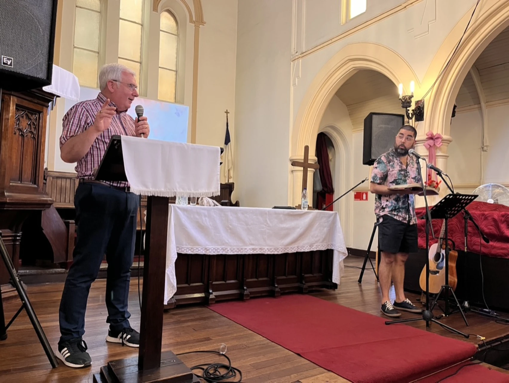 Bishop David speaking at one of the churches with Revd Max Imiliano Diaz