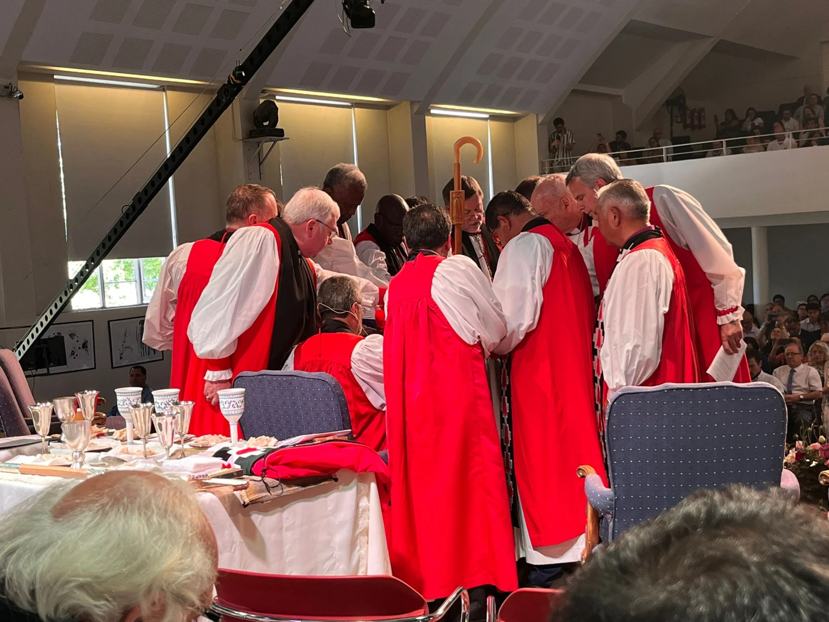 Bishop David participates in the laying on of hands