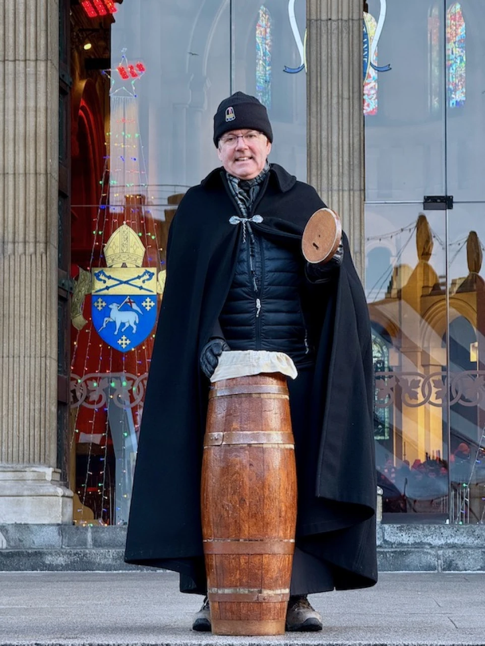 The Dean of Belfast invites donations in the traditional way