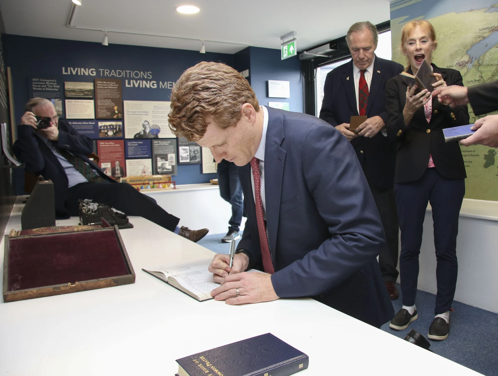 Joe Kennedy III signs the parish register