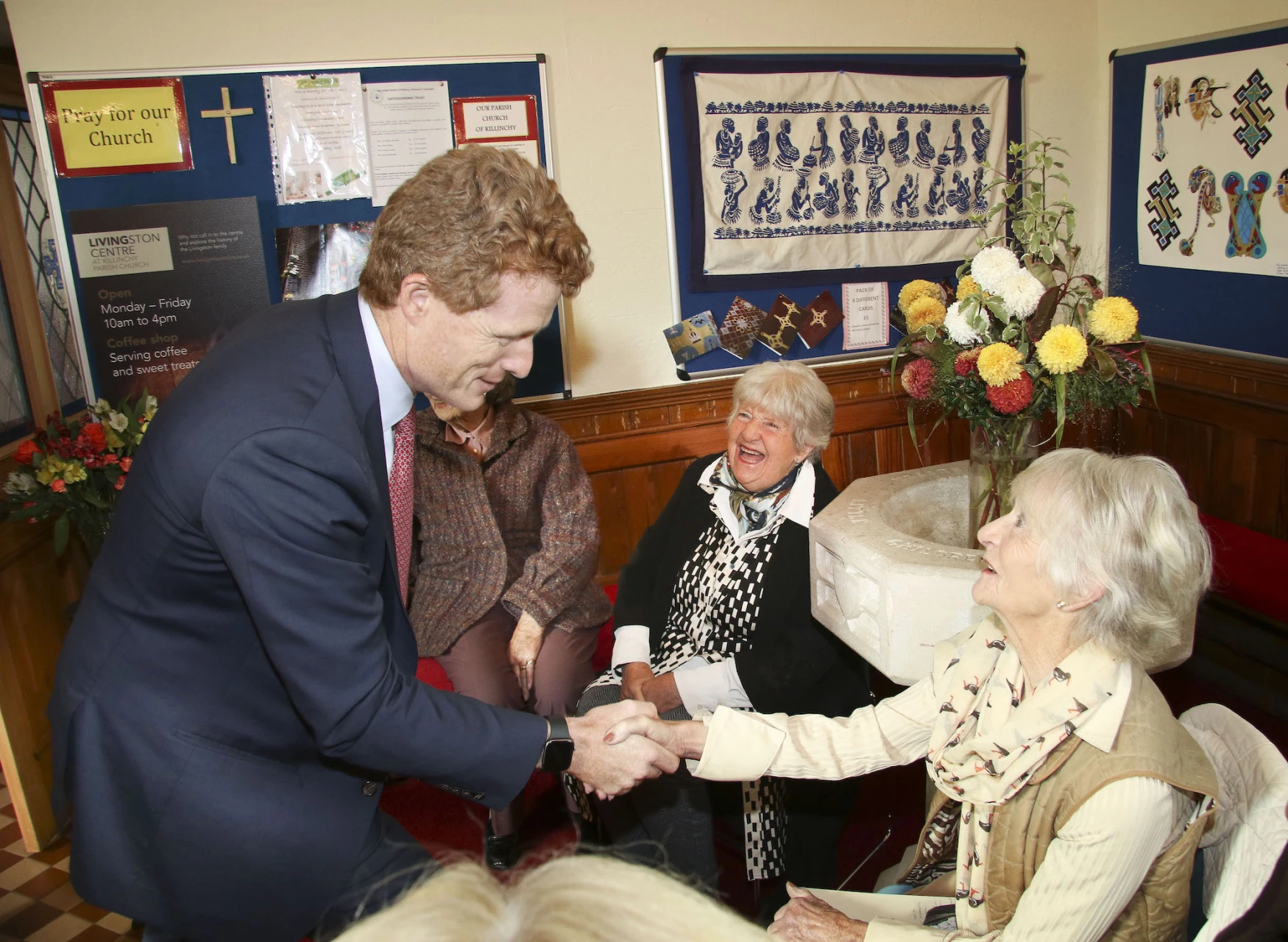 Julie Mackie greets Joe Kennedy III along with her sister, Mary Lee Jackson