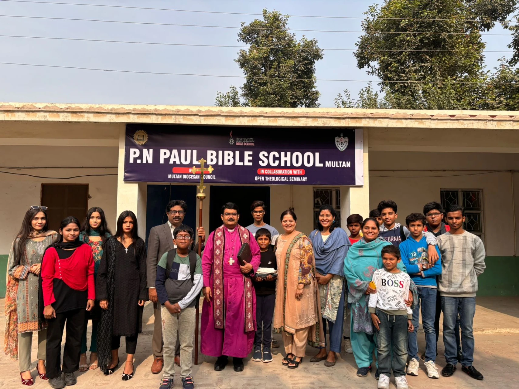 Young students outside the P.N. Paul Bible School