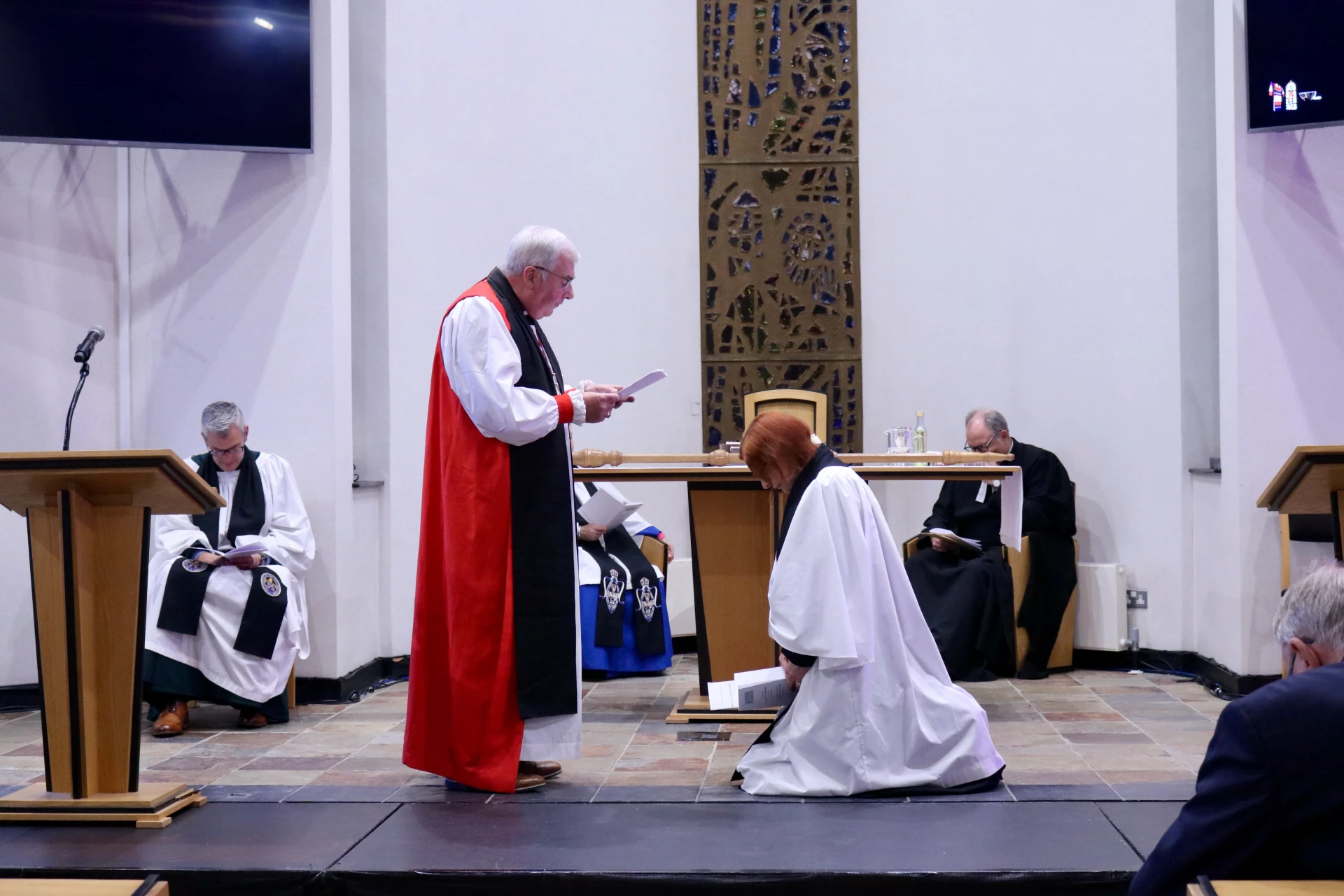 The bishop prays for Emma