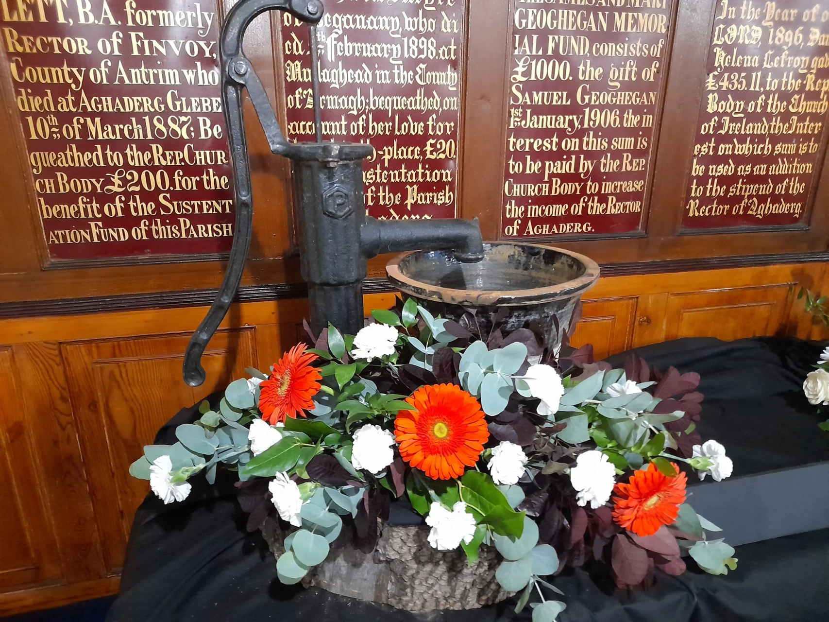 Water pump adorned by flowers