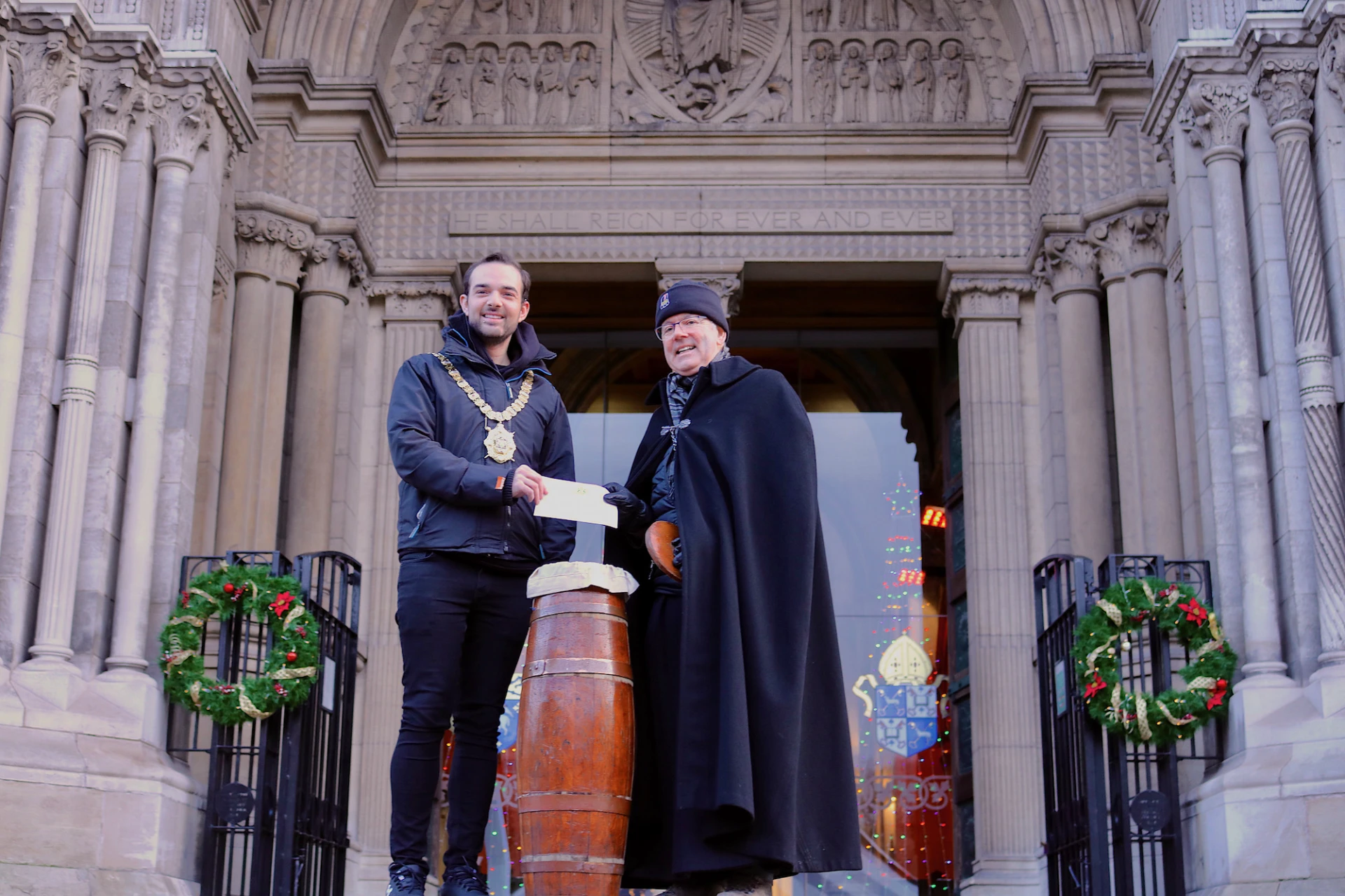 Councillor Micky Murray, Lord Mayor of Belfast makes a donation